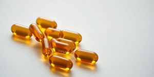 Omega-3 fish oil capsules and a calm, balanced body illustration.